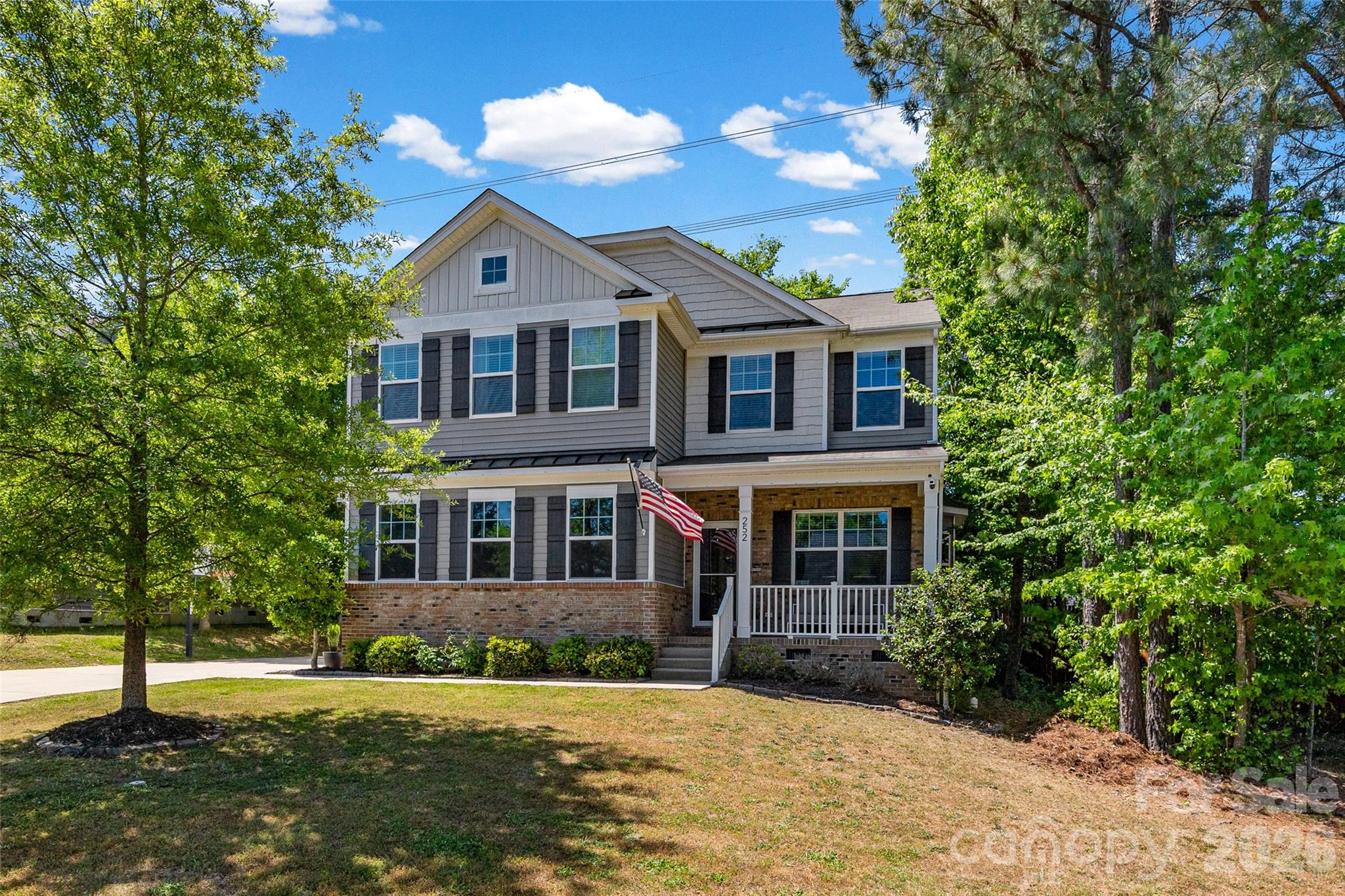a front view of a house with a yard