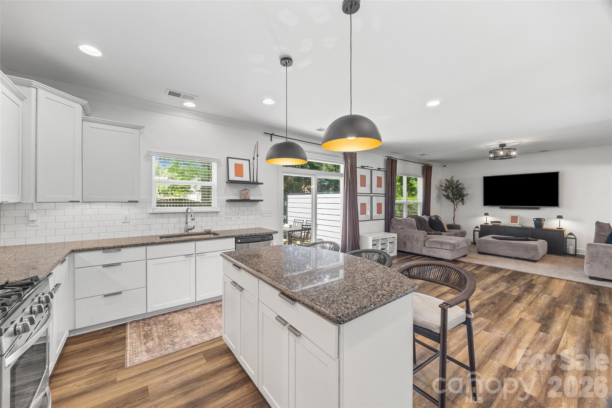 252 Hydrangea Drive Clover, SC 29710 - Photo 12 of 40 a kitchen with stainless steel appliances granite countertop sink stove and refrigerator