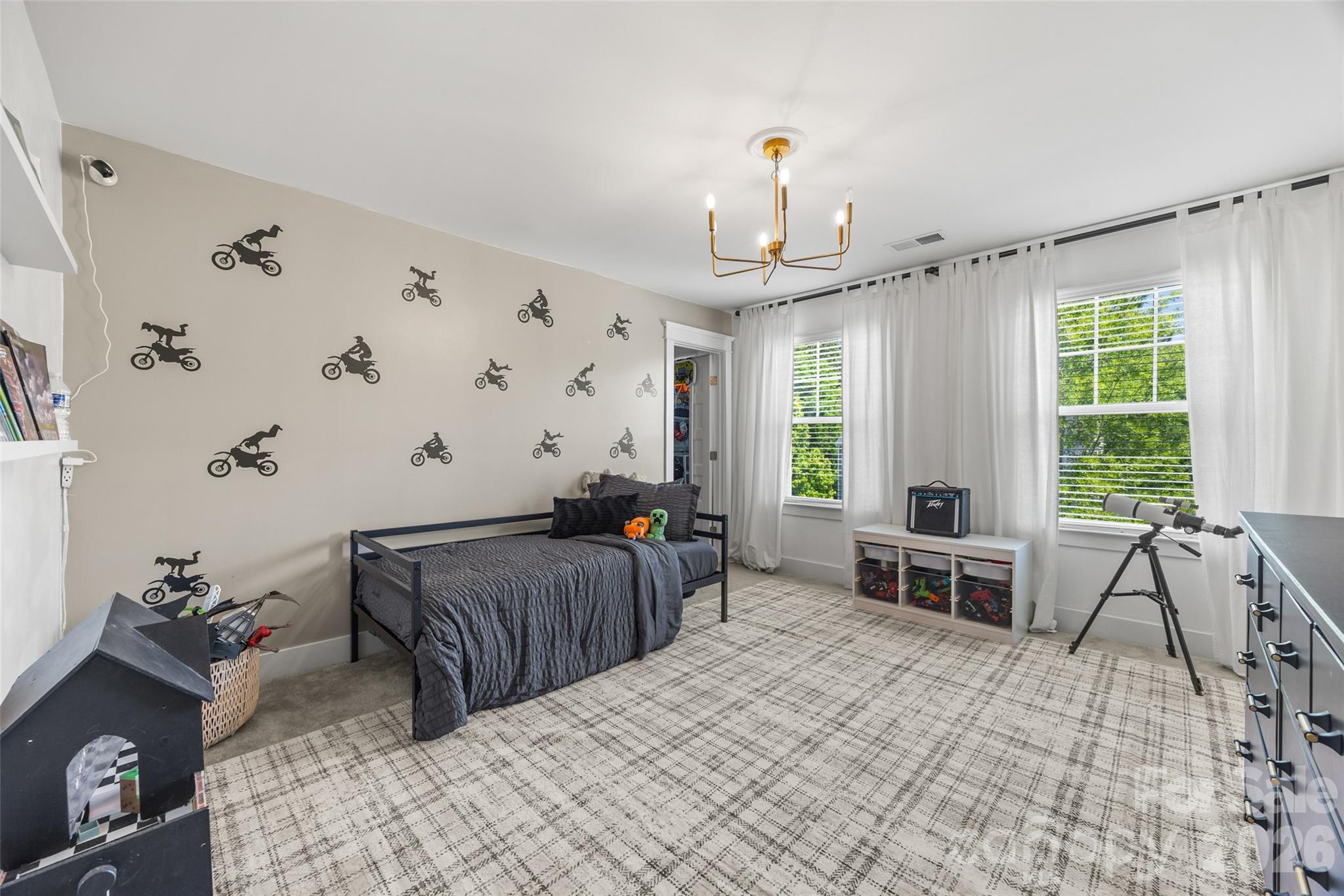 252 Hydrangea Drive Clover, SC 29710 - Photo 21 of 40 a bedroom with a bed and large windows