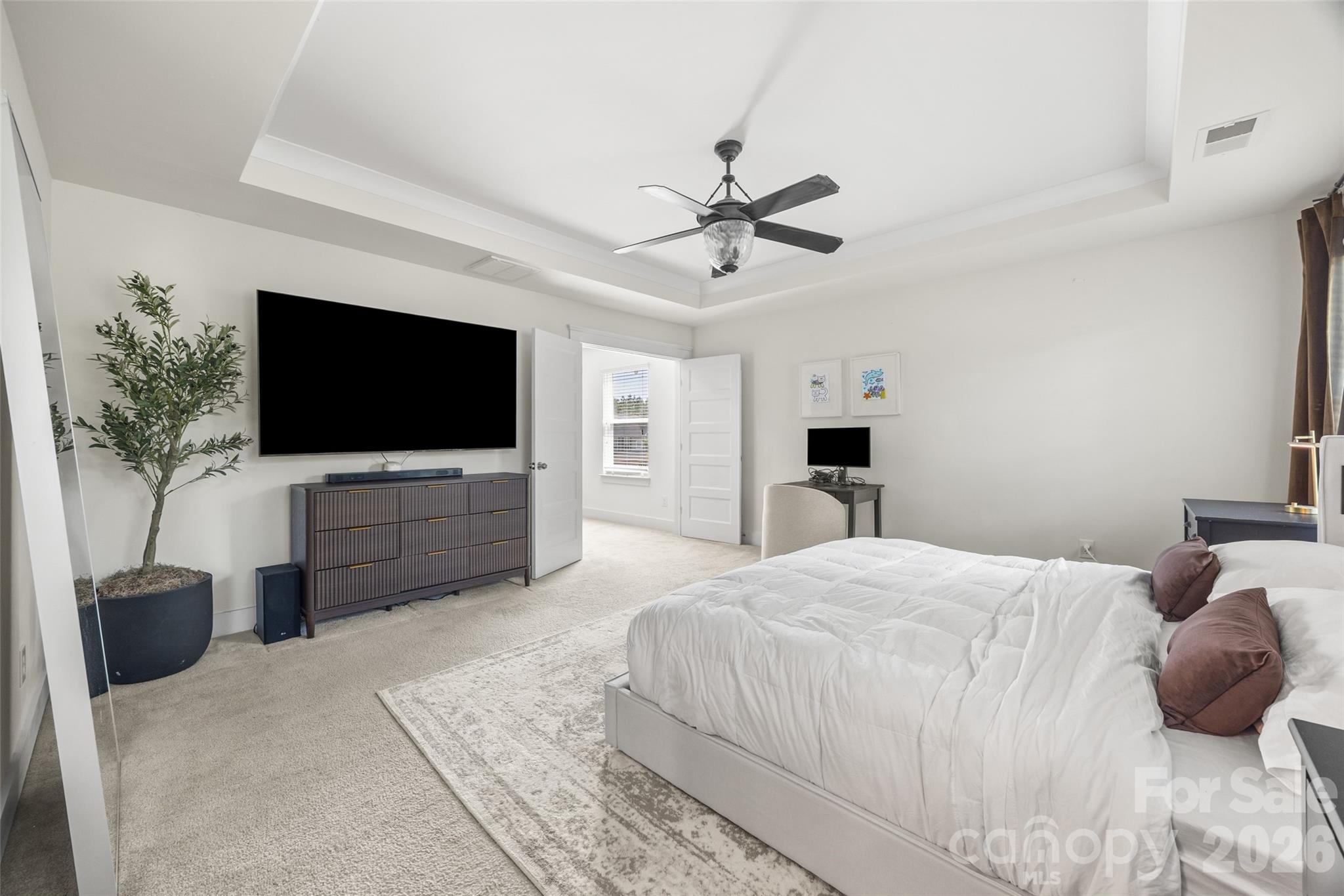 252 Hydrangea Drive Clover, SC 29710 - Photo 24 of 40 a bedroom with a large bed and a flat screen tv