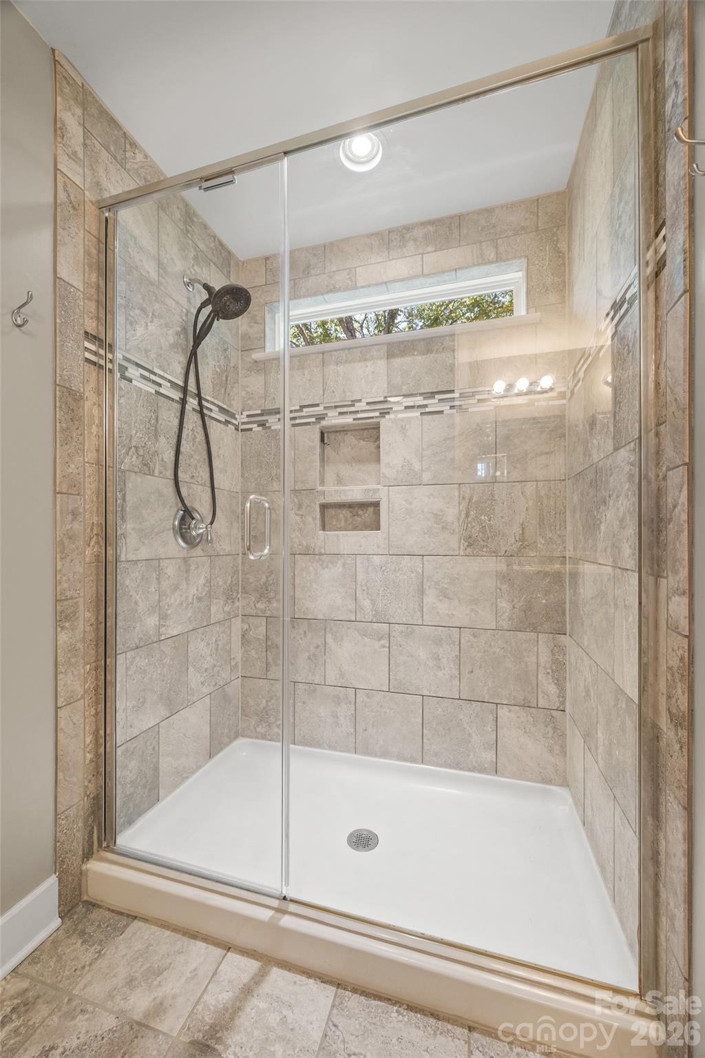 252 Hydrangea Drive Clover, SC 29710 - Photo 26 of 40 a bathroom with a shower and a tub