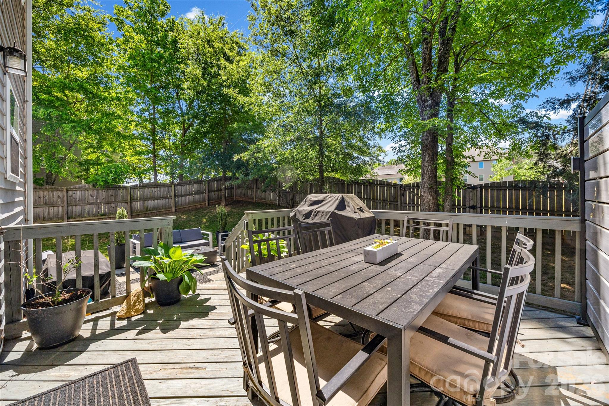 252 Hydrangea Drive Clover, SC 29710 - Photo 29 of 40 a view of a dinning table and chairs on the roof deck