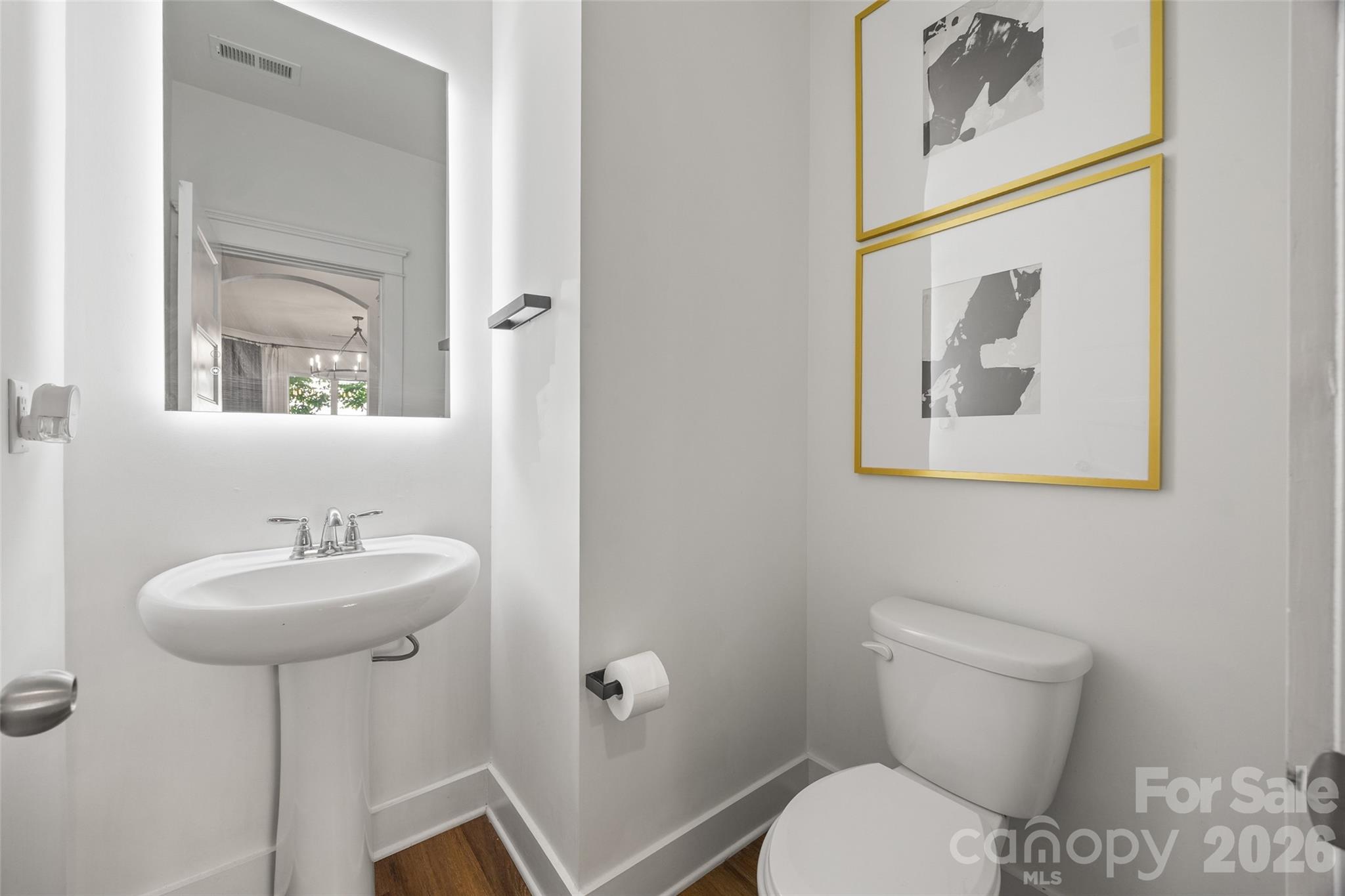 252 Hydrangea Drive Clover, SC 29710 - Photo 7 of 40 a bathroom with a toilet sink and mirror