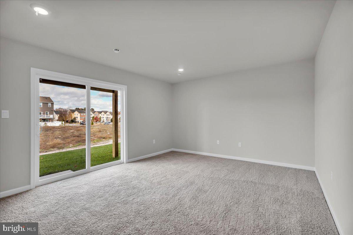 220 Sandy Rdg Road Sicklerville, NJ 08081 - Photo 13 of 24 a view of an empty room with a sliding door