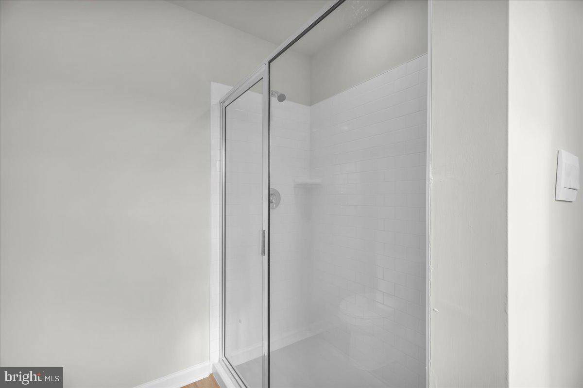 220 Sandy Rdg Road Sicklerville, NJ 08081 - Photo 19 of 24 a bathroom with a glass shower door