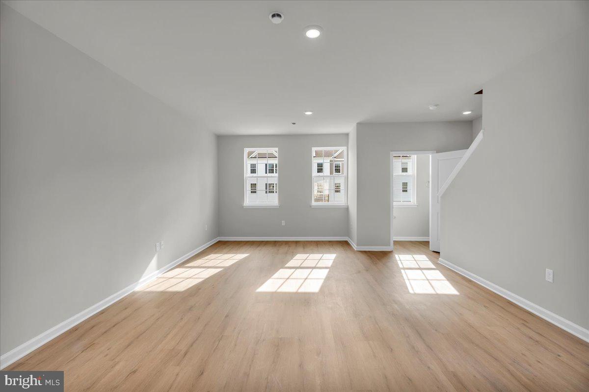 220 Sandy Rdg Road Sicklerville, NJ 08081 - Photo 4 of 24 wooden floor in an empty room with a window