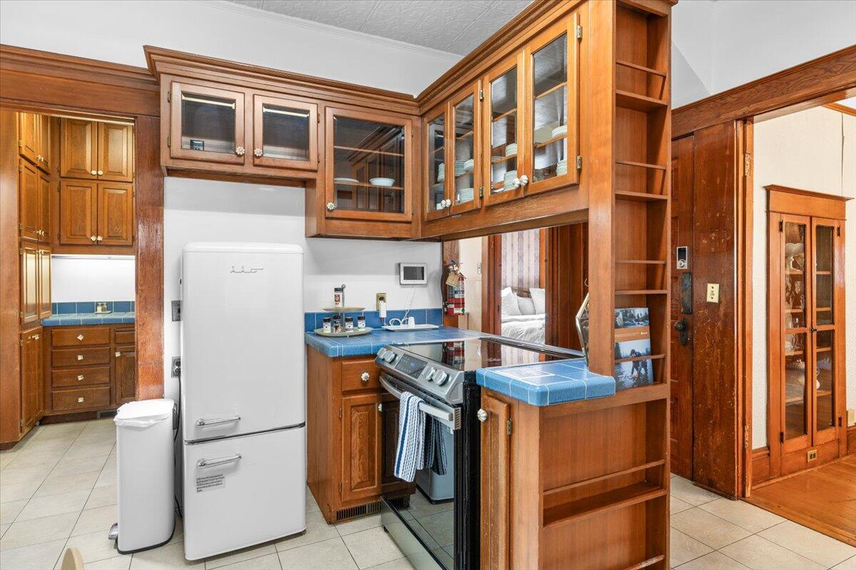 139 Southwest I Street Grants Pass, OR 97526 - Photo 19 of 47 a kitchen view with stainless steel appliances granite countertop a stove and a refrigerator