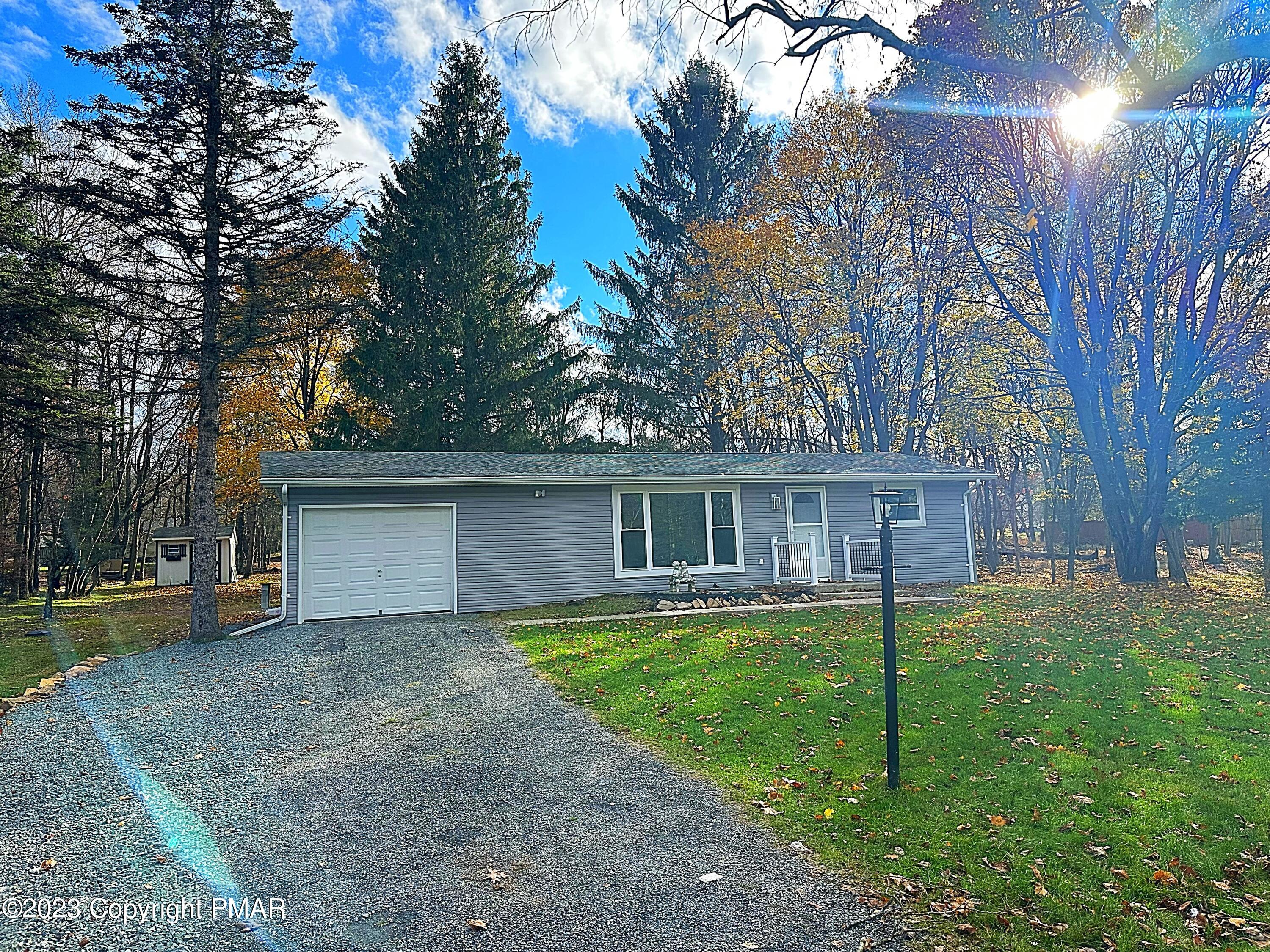 350 Mountain Road Albrightsville, PA 18210 - Photo 1 of 23 front view of a house with a yard and trees