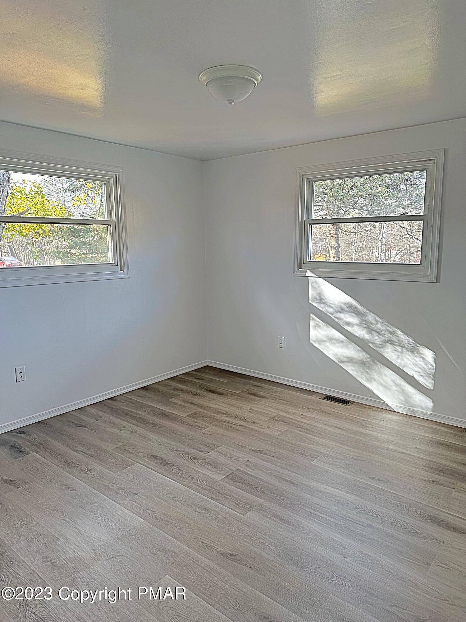 350 Mountain Road Albrightsville, PA 18210 - Photo 12 of 23 a view of empty room with wooden floor and fan