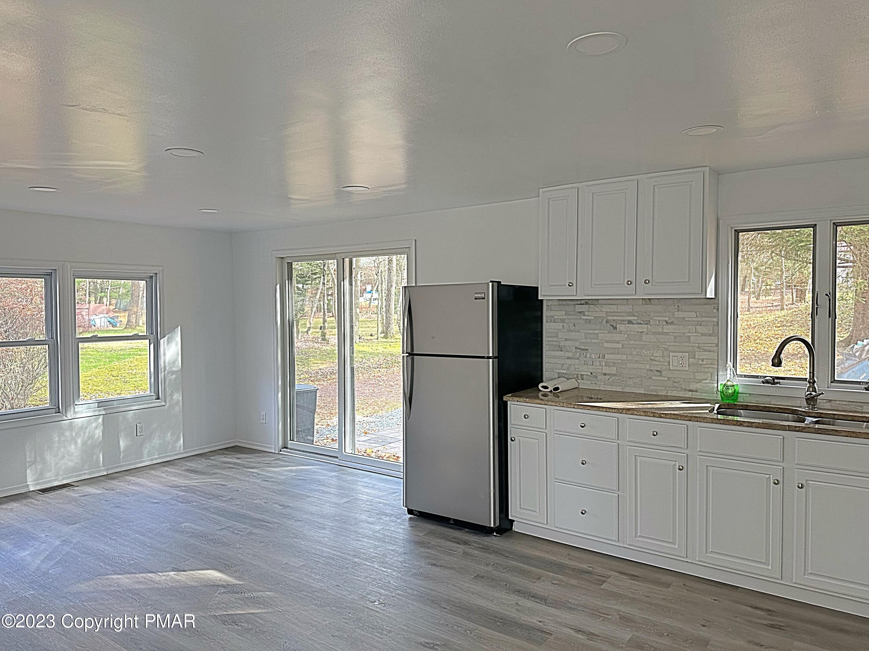 350 Mountain Road Albrightsville, PA 18210 - Photo 8 of 23 a kitchen with a sink a refrigerator and window