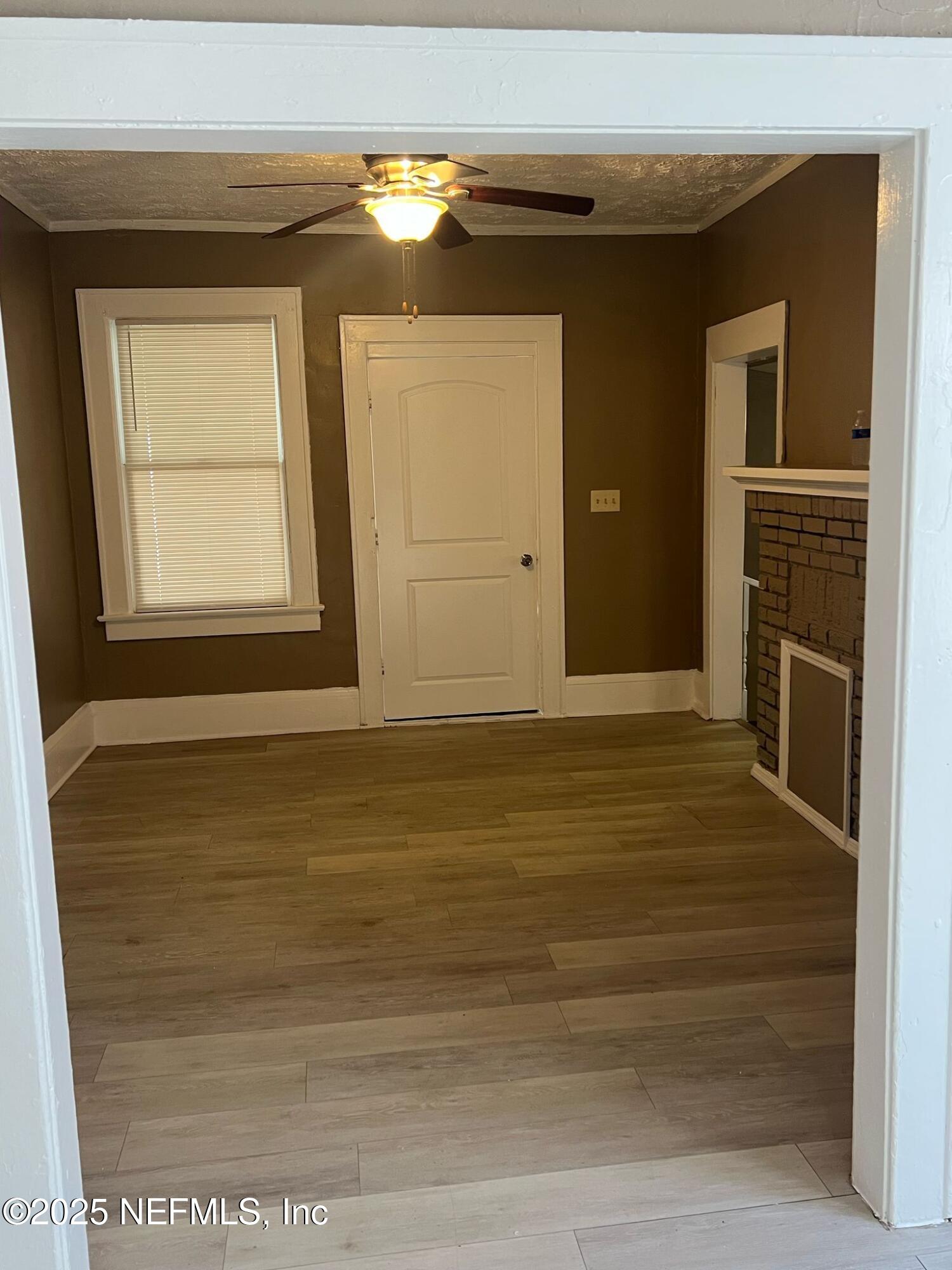 2815 Fleming Street Jacksonville, FL 32254 - Photo 17 of 37 a view of an empty room with a fireplace and a window