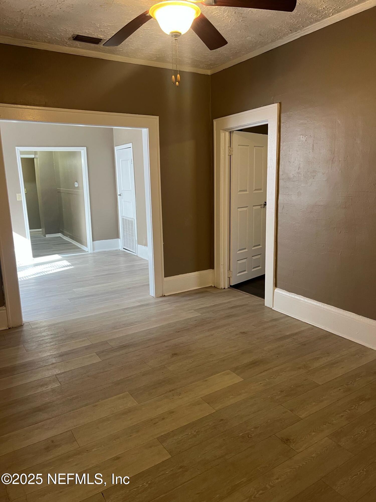 2815 Fleming Street Jacksonville, FL 32254 - Photo 19 of 37 a view of an empty room with wooden floor