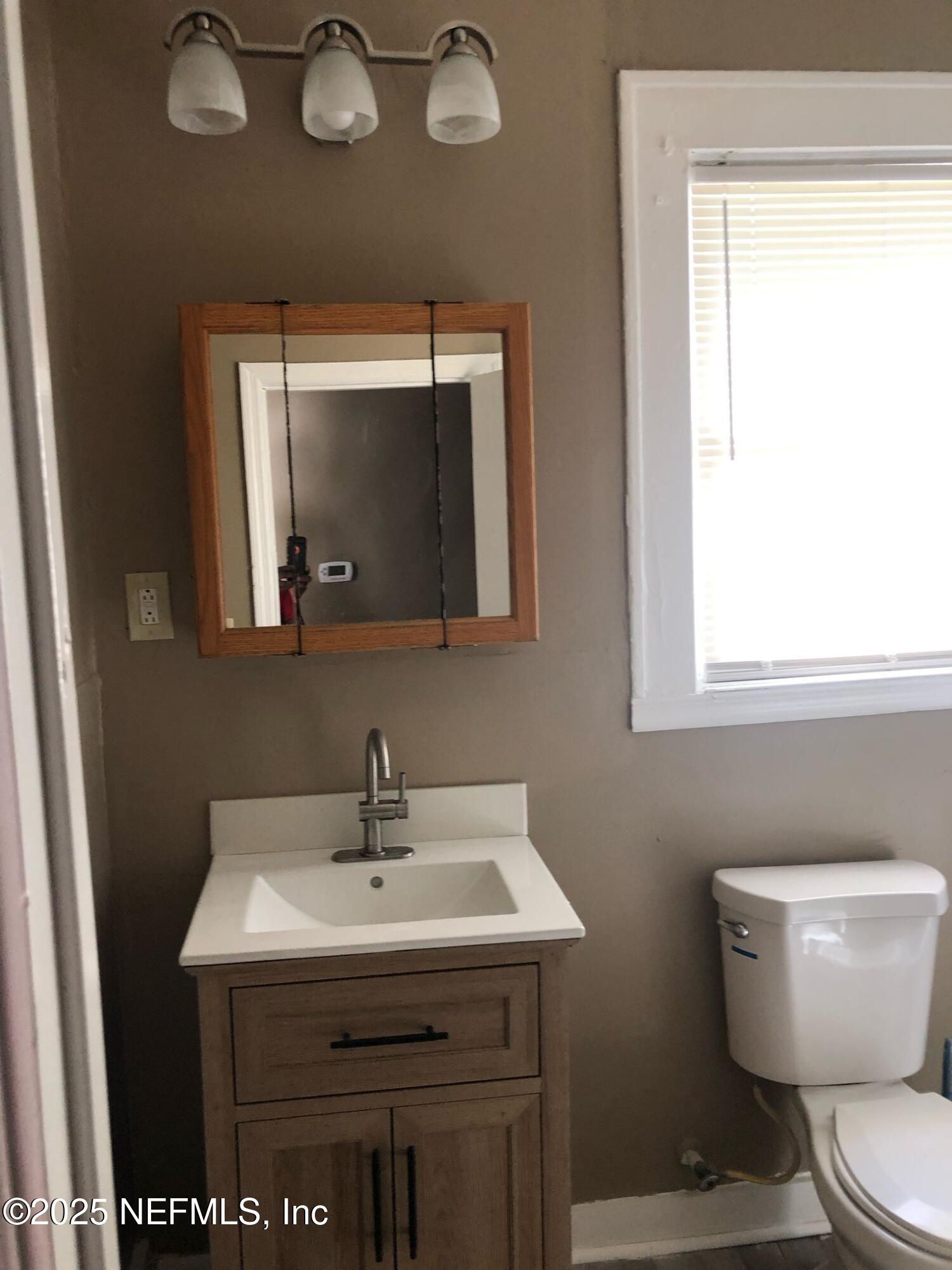 2815 Fleming Street Jacksonville, FL 32254 - Photo 25 of 37 a bathroom with a sink and a mirror