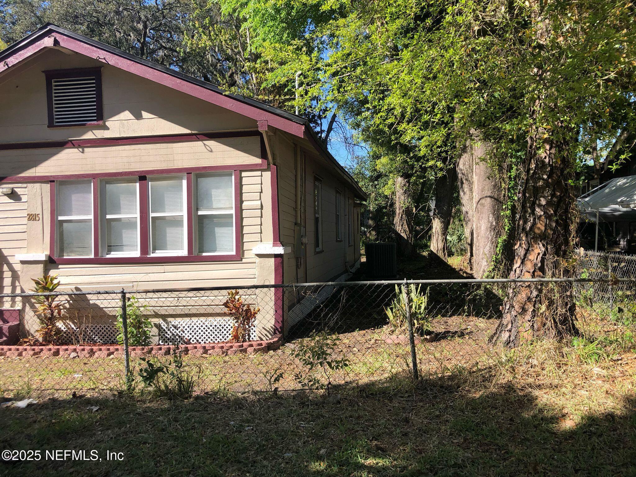 2815 Fleming Street Jacksonville, FL 32254 - Photo 27 of 37 a backyard of a house with lots of green space