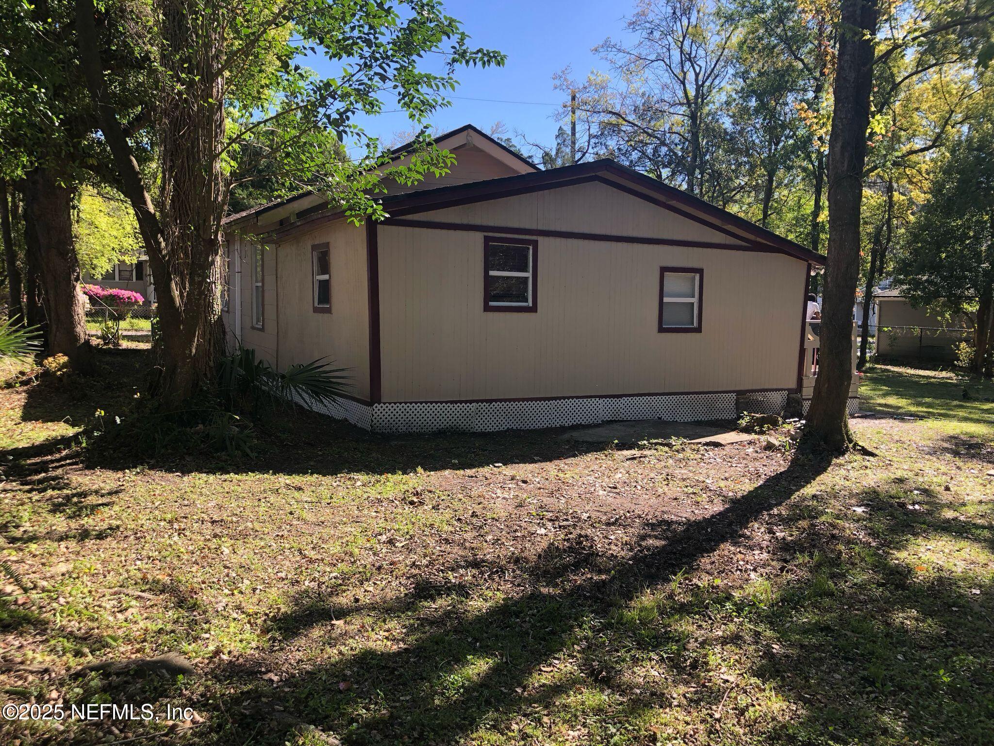 2815 Fleming Street Jacksonville, FL 32254 - Photo 28 of 37 a house with trees in the background