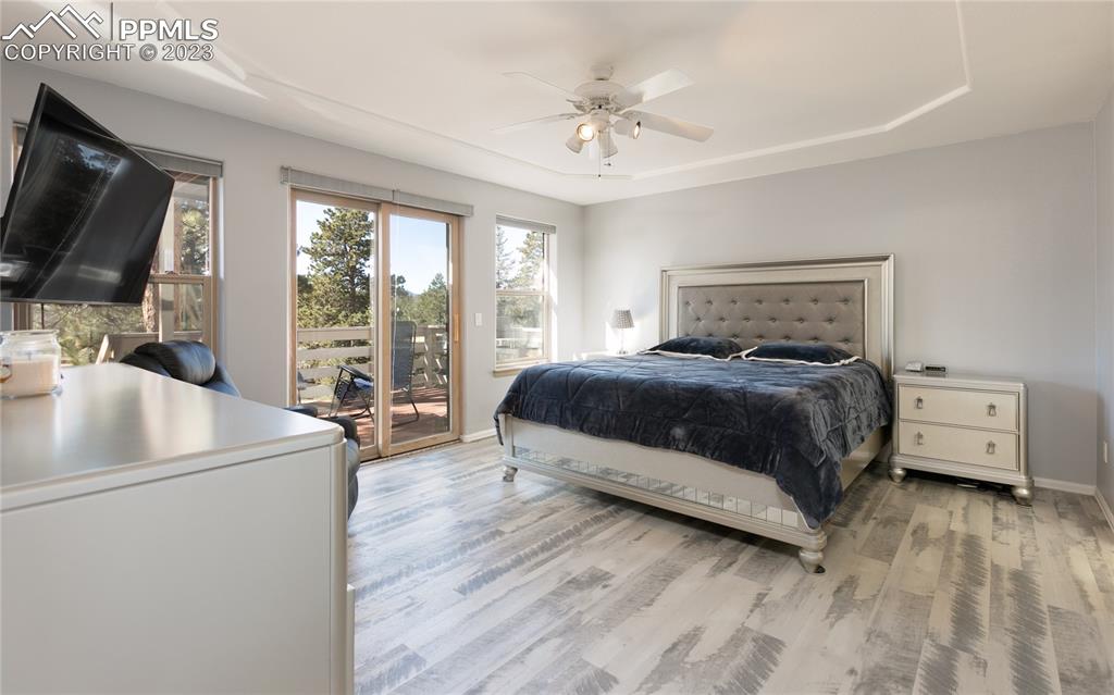 840 West Kelly Road Woodland Park, CO 80863 - Photo 12 of 37 a bedroom with a bed and a flat screen tv