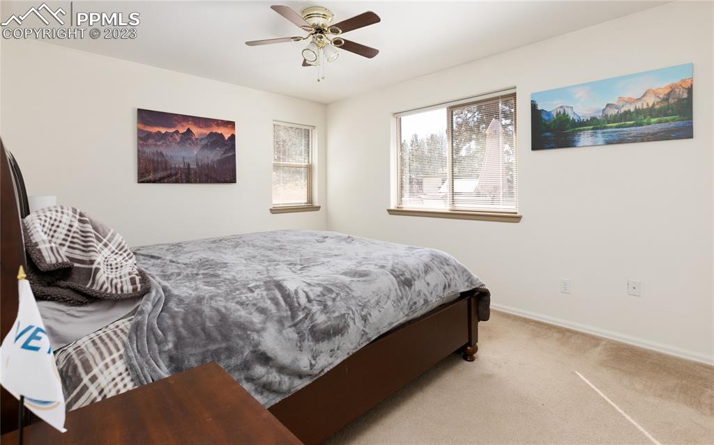 840 West Kelly Road Woodland Park, CO 80863 - Photo 15 of 37 a bedroom with a bed and a window