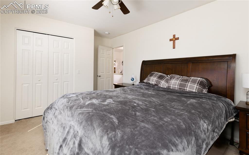 840 West Kelly Road Woodland Park, CO 80863 - Photo 16 of 37 a bedroom with a bed and ceiling fan