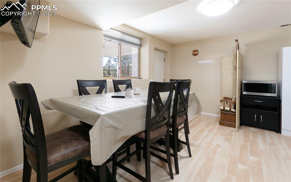 840 West Kelly Road Woodland Park, CO 80863 - Photo 27 of 37 a view of a dining room with furniture