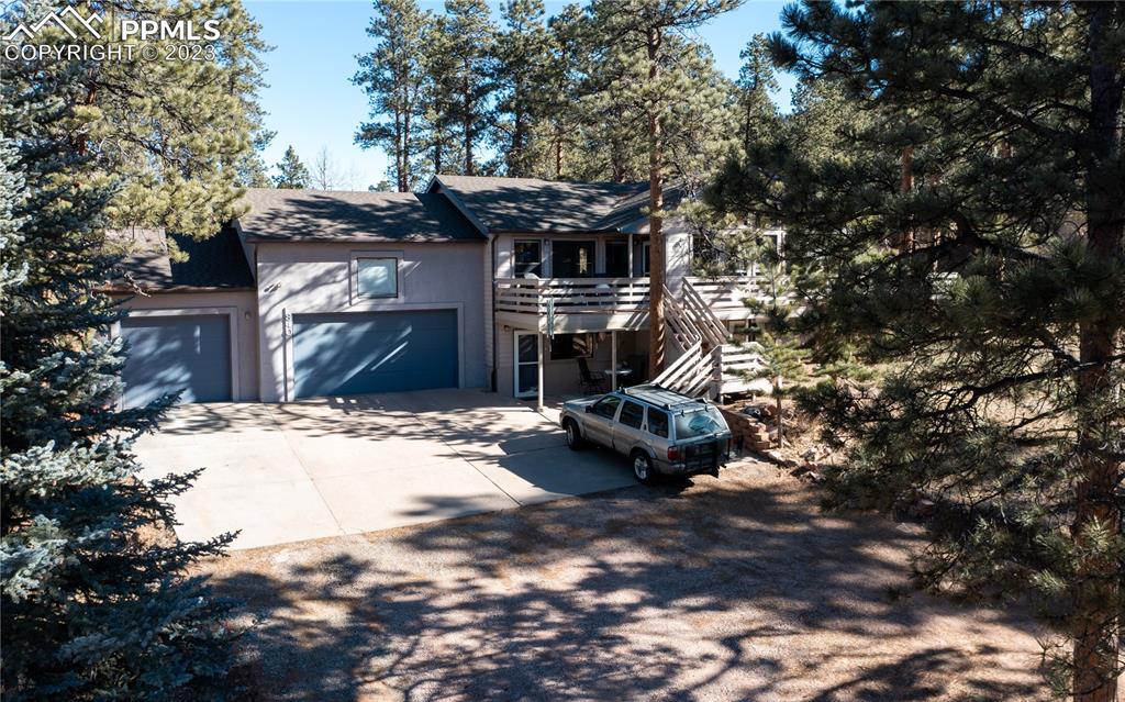 840 West Kelly Road Woodland Park, CO 80863 - Photo 3 of 37 a view of a backyard with table and chairs and a fire pit