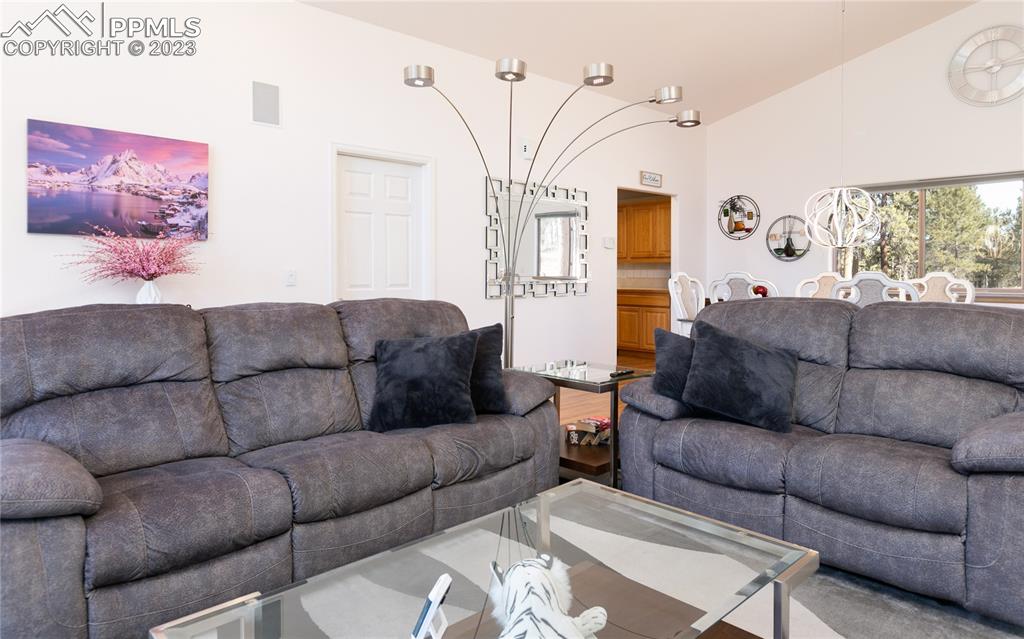 840 West Kelly Road Woodland Park, CO 80863 - Photo 6 of 37 a living room with furniture and a large window