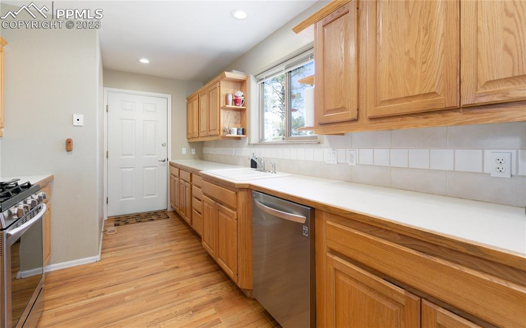 840 West Kelly Road Woodland Park, CO 80863 - Photo 10 of 37 a kitchen with sink cabinets and window