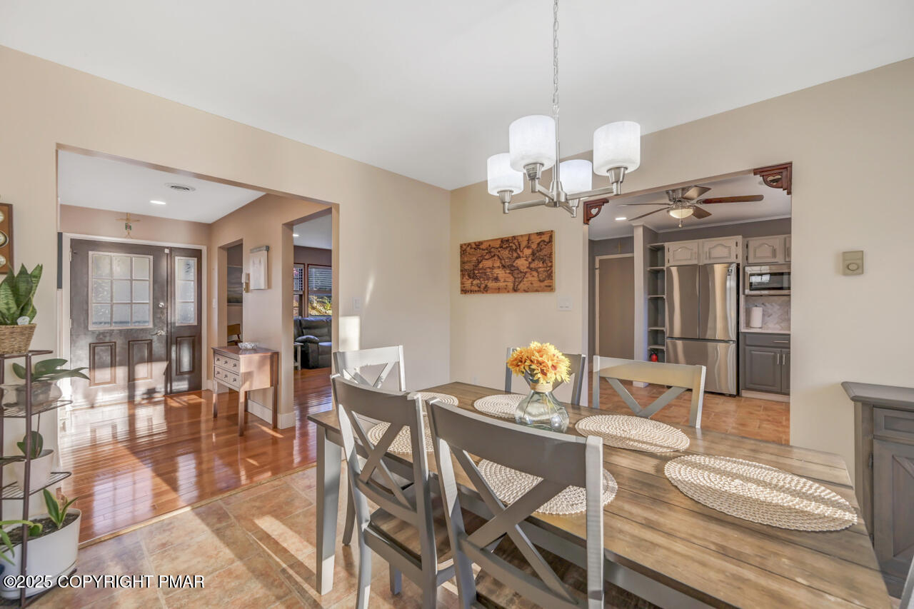 9 Gap View Heights Road East Stroudsburg, PA 18301 - Photo 15 of 57 a view of a dining room with furniture wooden floor and chandelier