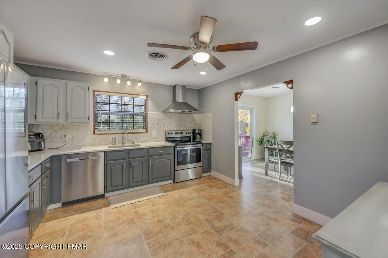 9 Gap View Heights Road East Stroudsburg, PA 18301 - Photo 18 of 57 a large kitchen with granite countertop a stove top oven a sink a dining table and chairs