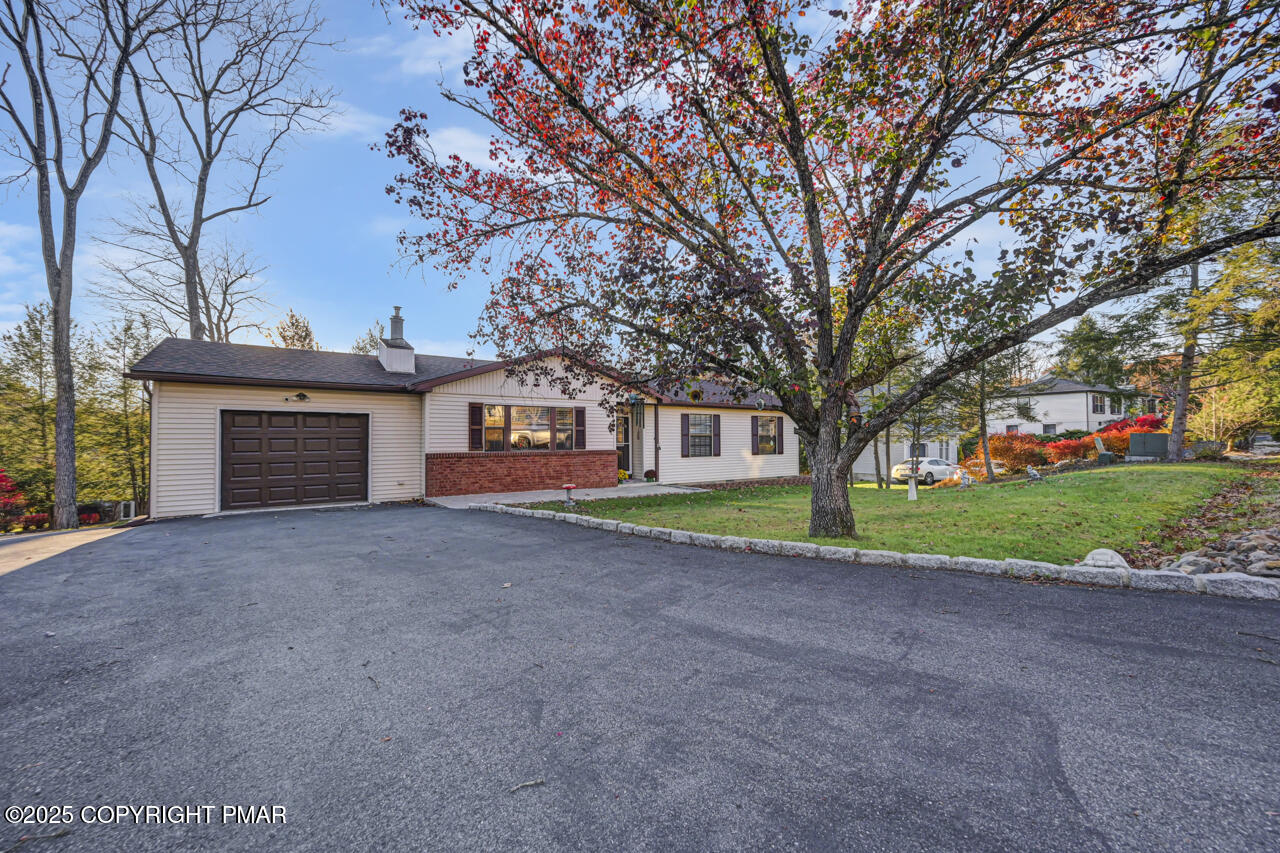 9 Gap View Heights Road East Stroudsburg, PA 18301 - Photo 2 of 57 a view of a house with a yard and garage