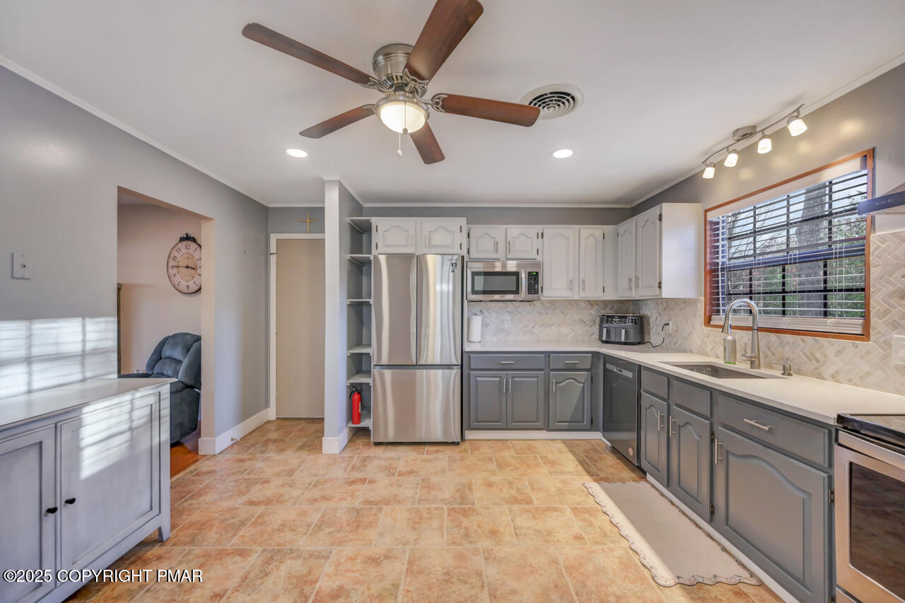 9 Gap View Heights Road East Stroudsburg, PA 18301 - Photo 21 of 57 a large kitchen with stainless steel appliances granite countertop a refrigerator and a sink
