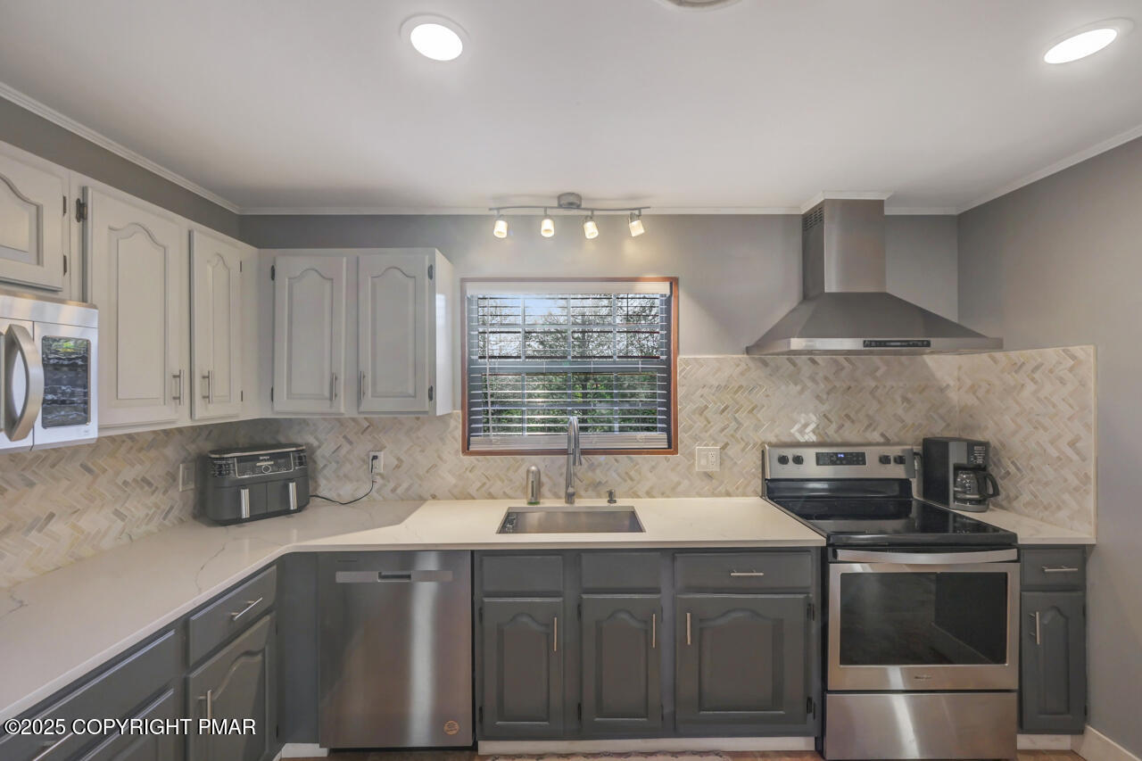 9 Gap View Heights Road East Stroudsburg, PA 18301 - Photo 22 of 57 a kitchen with a sink stove and cabinets