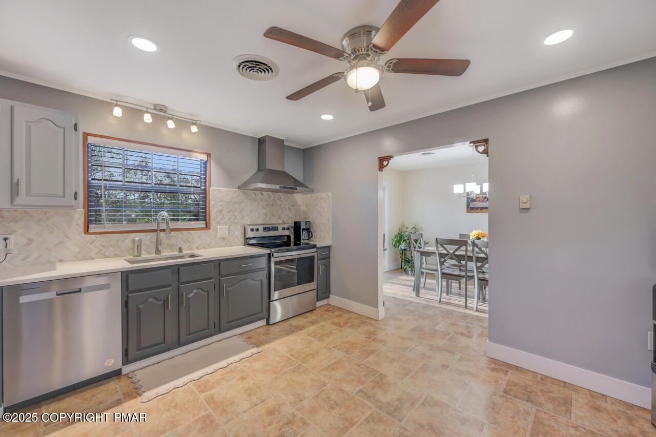 9 Gap View Heights Road East Stroudsburg, PA 18301 - Photo 25 of 57 a kitchen with stainless steel appliances granite countertop a sink cabinets and wooden floor