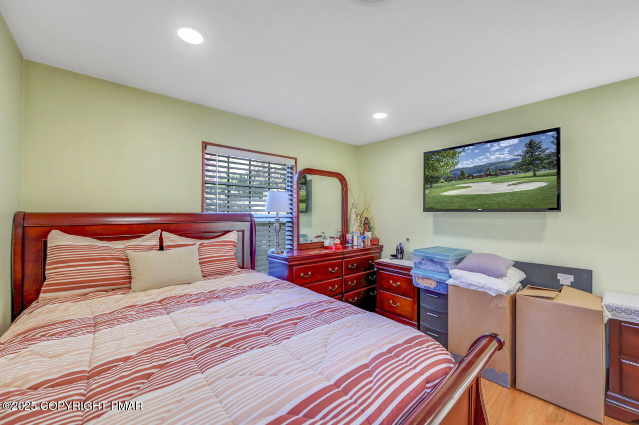 9 Gap View Heights Road East Stroudsburg, PA 18301 - Photo 36 of 57 a bedroom with a bed and wooden floor