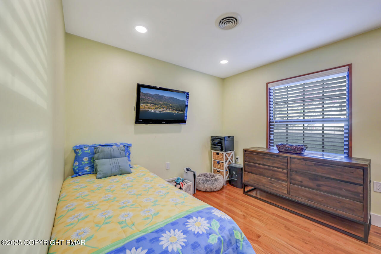 9 Gap View Heights Road East Stroudsburg, PA 18301 - Photo 39 of 57 a bedroom with a bed and a flat screen tv