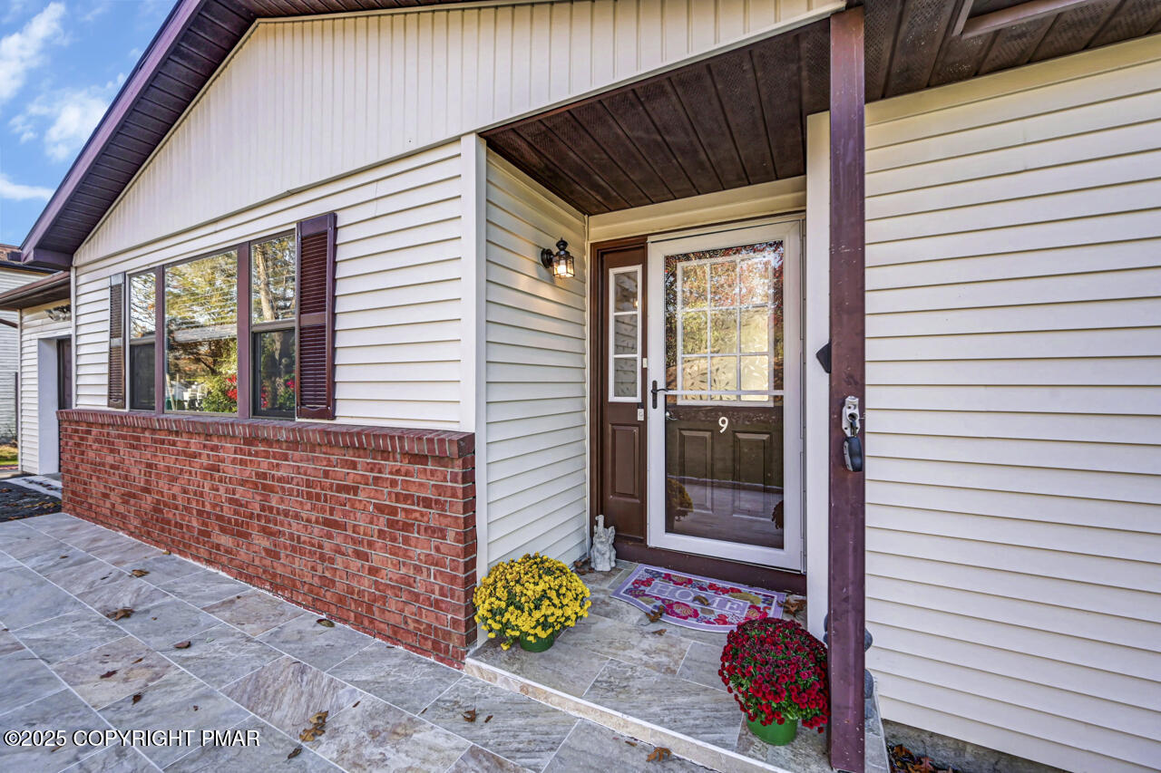 9 Gap View Heights Road East Stroudsburg, PA 18301 - Photo 6 of 57 a front view of a house with a garden