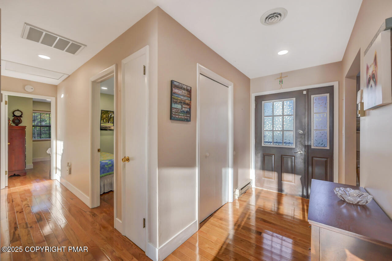9 Gap View Heights Road East Stroudsburg, PA 18301 - Photo 8 of 57 a view of a hallway with wooden floor and a living room