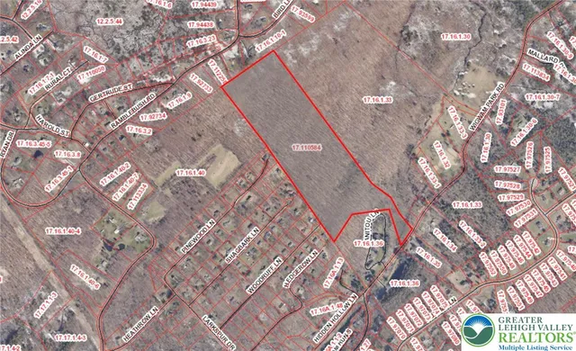 a white bath tub sitting next to a white walls