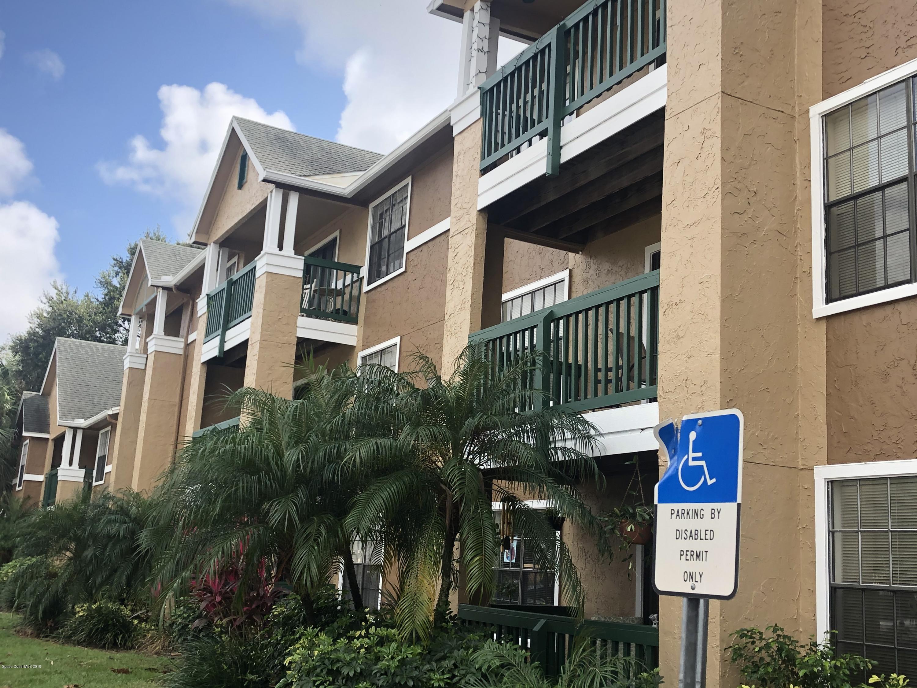 7667 North Wickham Road, Unit 915 Melbourne, FL 32940 - Photo 1 of 12 a sign that is on the side of a building