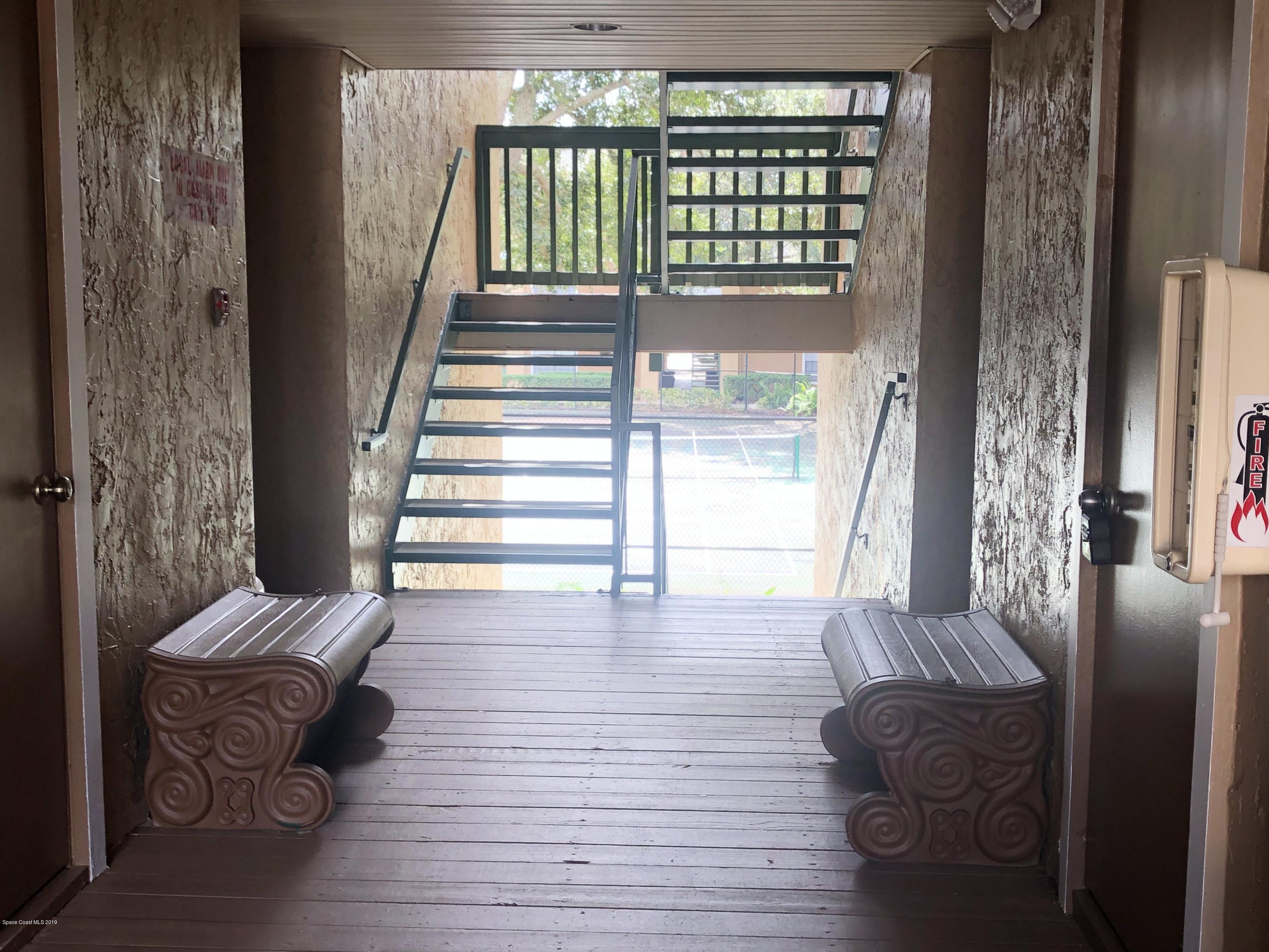 7667 North Wickham Road, Unit 915 Melbourne, FL 32940 - Photo 10 of 12 a view of entryway and hall with wooden floor