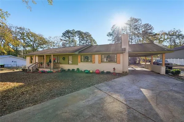 a view of a house with a yard and garage