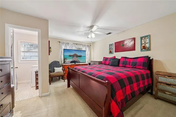 a bedroom with a bed and a closet