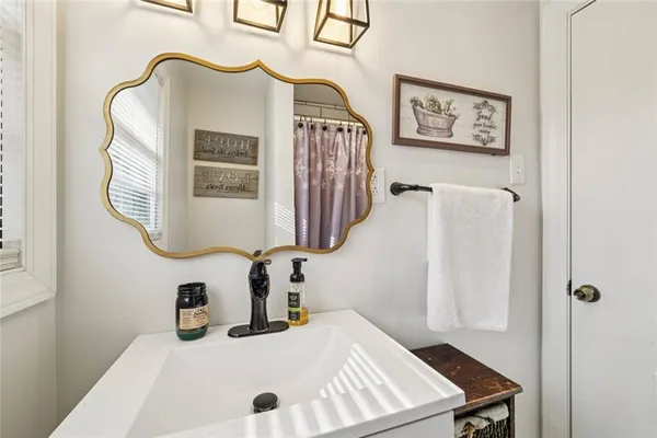 a bathroom with a sink and a mirror