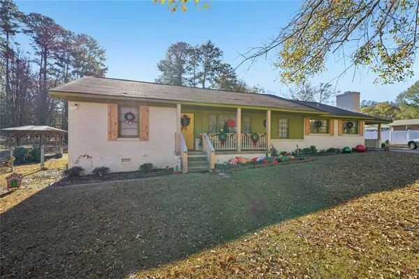 a front view of a house with garden