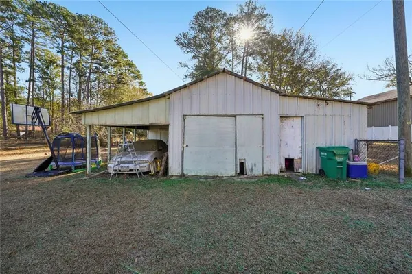 a view of a house with a yard and garage