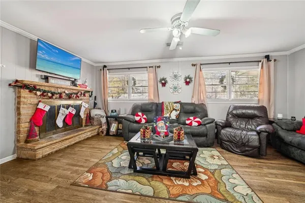 a living room with furniture and a flat screen tv