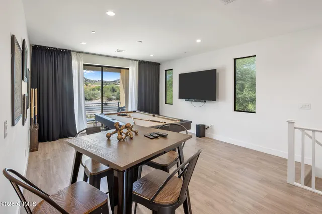 a spacious bedroom with two beds and a chandelier