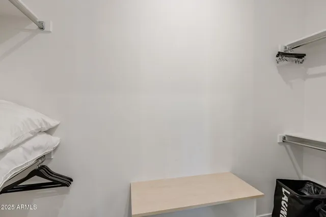 a bedroom with furniture and a window