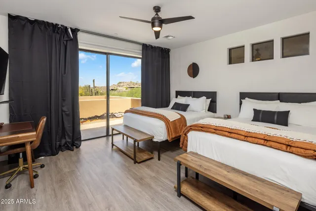 a view of a chairs and table in patio with a lake view