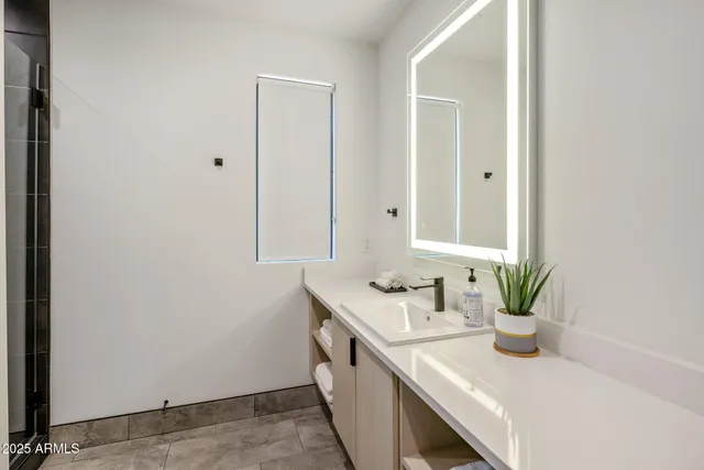 an aerial view of a house with garden space and street view