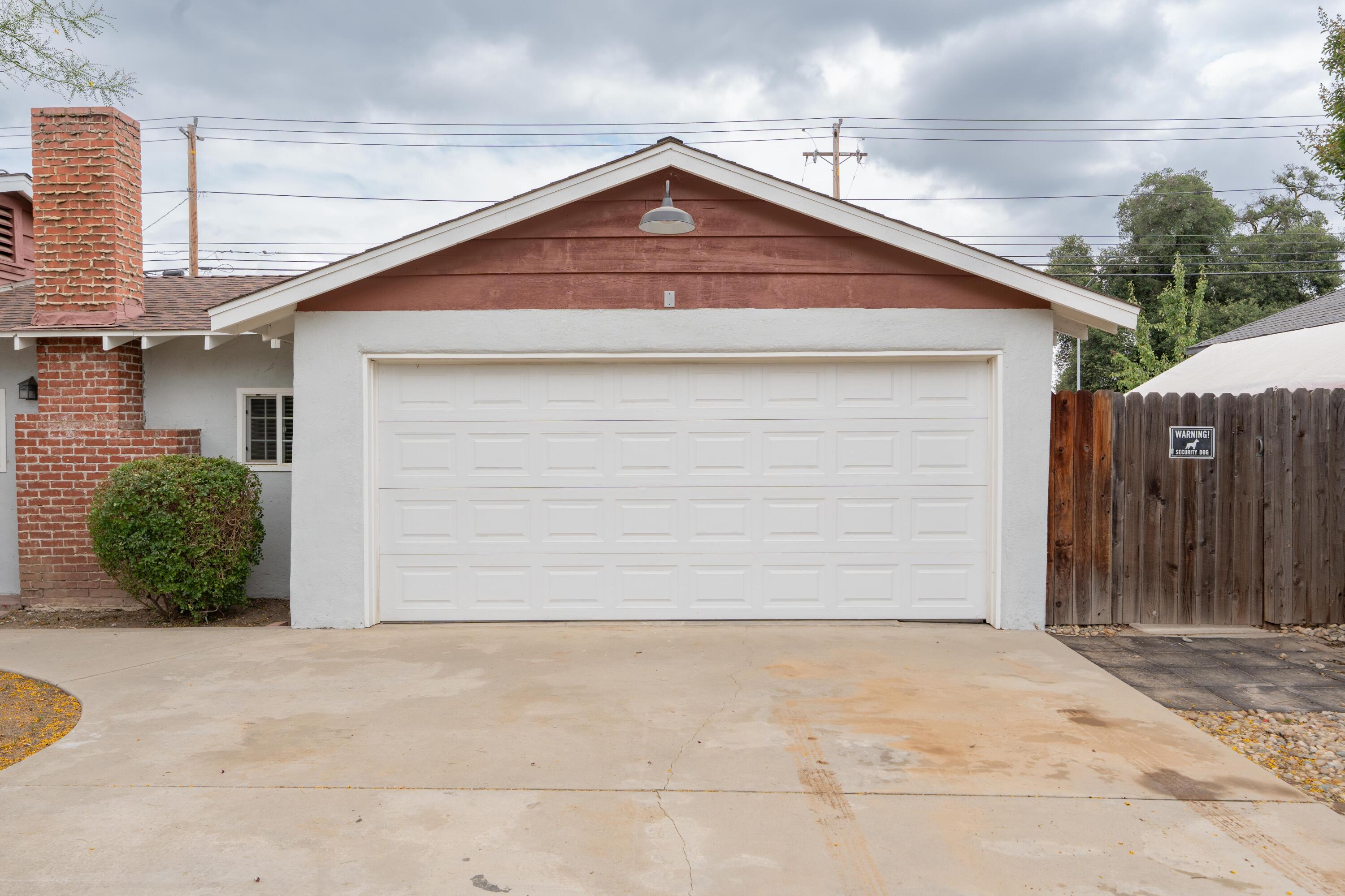 570 North Birch Avenue Reedley, CA 93654 - Photo 10 of 52 a front view of a house with a garage
